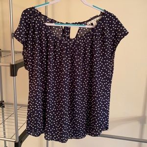 Navy and white polka dot sleeveless blouse